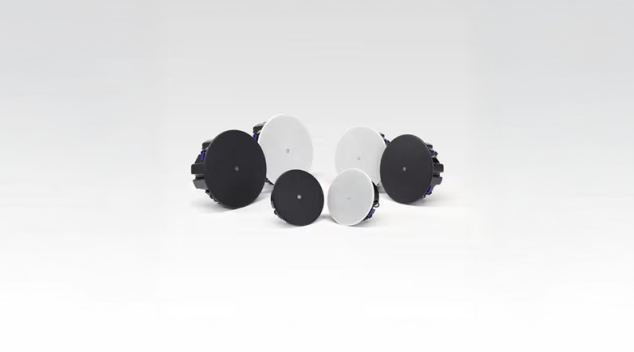 Ceiling mounted background music speakers in black and white designed for hospitality sound systems