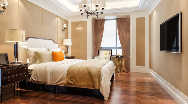 Luxury hotel room with elegant lighting, smart TV, modern decor, and comfortable bed setup for enhanced guest entertainment