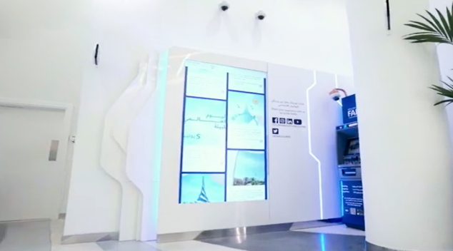 Interactive digital wall with touchscreen display in a visitor centre designed for immersive engagement experiences