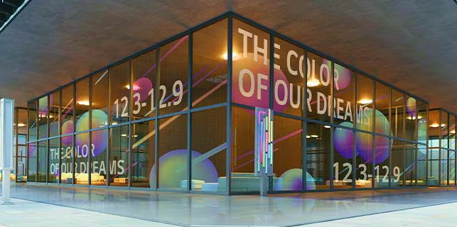 Transparent video wall display installed on glass facade for modern digital advertising