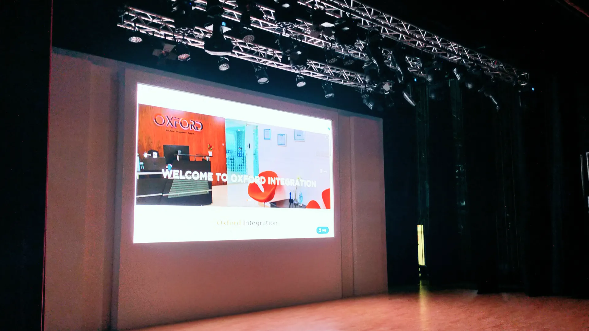 Al Ain Municipality auditorium stage showcasing LED screen installation and intelligent lighting setup by Oxford Integration