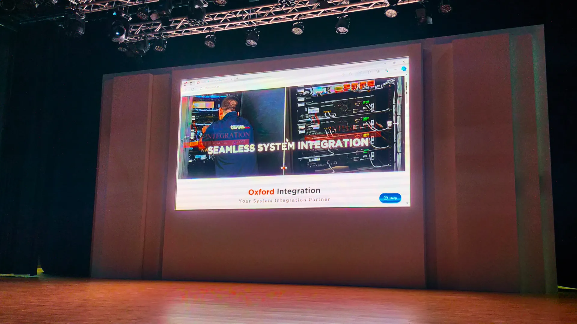 Al Ain Municipality auditorium stage featuring projection display and lighting truss designed and integrated by Oxford Integration