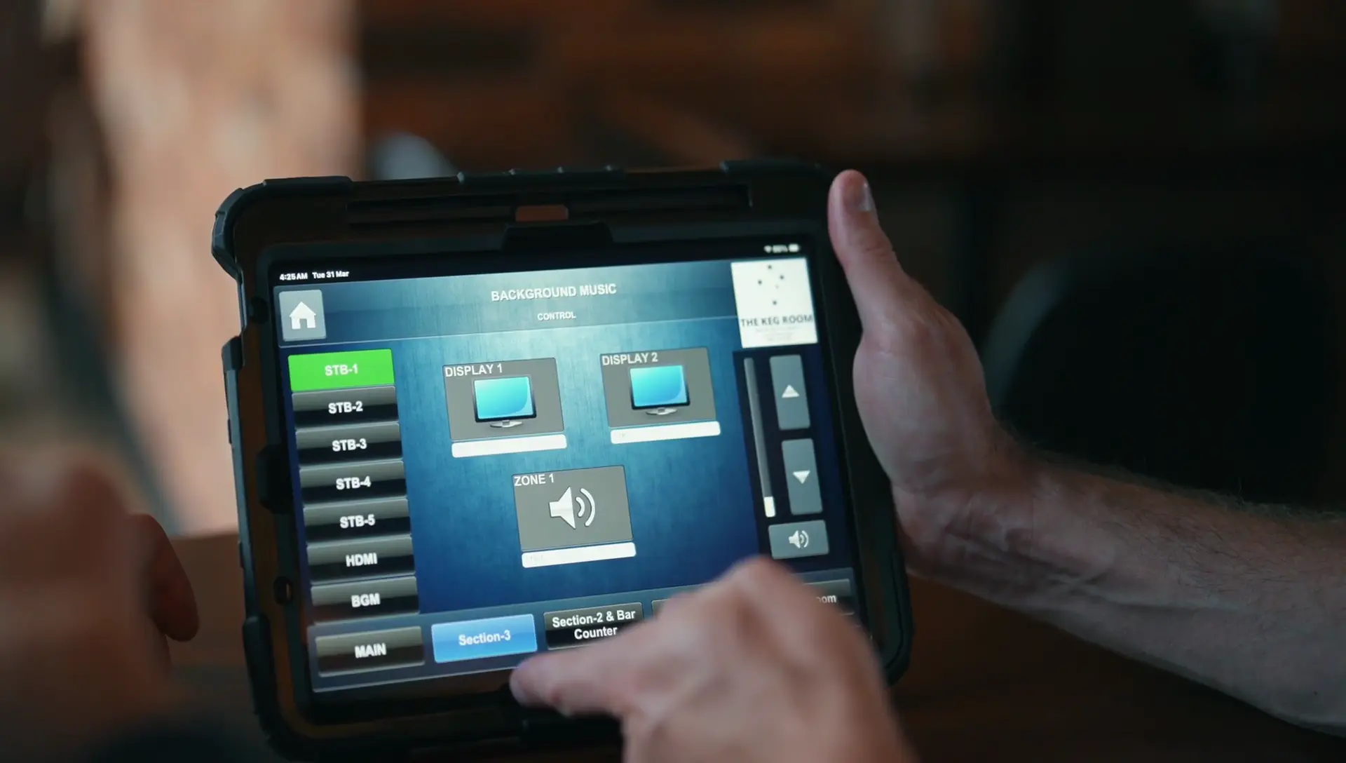 Premium Restaurant Bgm System With Zone Control For Keg Room, Abu Dhabi 4 Tablet displaying Crestron background music control interface installed by Oxford Integration at KEG Room Restaurant Abu Dhabi